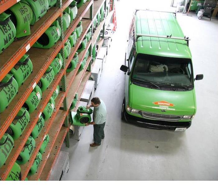 SERVPRO van and equipment in a warehouse